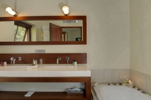 in a two bedroom luxury suite there is one bath and one shower Custom 300x199